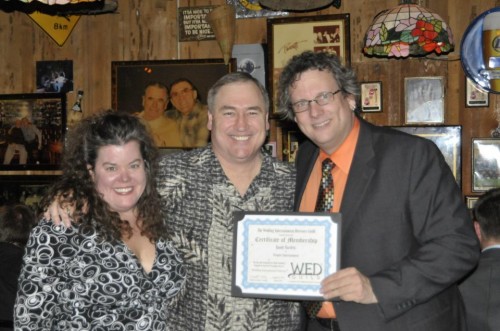 Peter Merry & Elisabeth Scott Daley presenting Randy Bartlett with his WED Guild® Membership Certificate