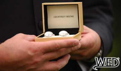 wedding ceremony groom holding geoffrey beene silver cuff links in wooden box and Wedding Entertainment Director® logo